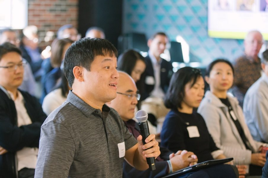Audience member asking a question during the Discovery Day 2026 scientific program