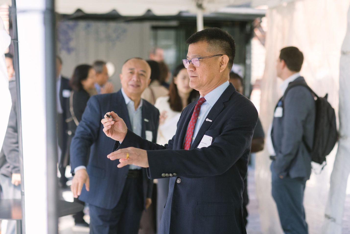 Guests signing the ChemPartner wall at Discovery Day 2026 in Watertown, Massachusetts